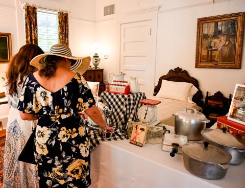 Guests perusing the exhibit at the Merrick House
