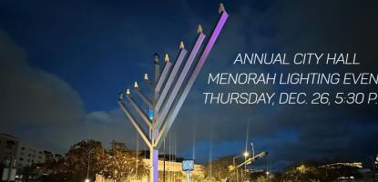 A menorah is lit in front of City Hall