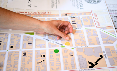 Finger pointing at a zoning map in north Coral Gables
